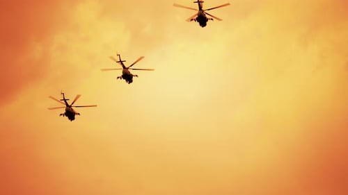 Helicopters Flying into the Sunset Sky