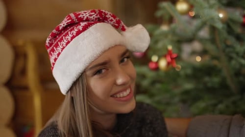 Close up of a woman with Christmas hat smiling