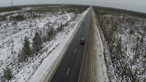 Car On The Road In Winter From Air
