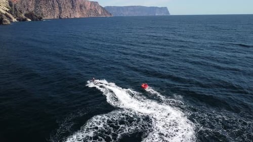 Jet Ski Pulling Raft on Ocean Adventure