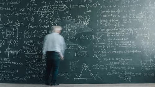 Time Lapse of Smart Mature Man Professor Writing Equations on Chalkboard