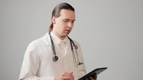Doctor Using Tablet Explains Medical Information