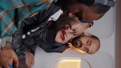 Adults Sitting In Airplane Near Window