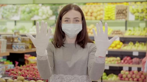 Brunette Caucasian Woman Posing in Grocery Wearing Face Mask and Protective Gloves. Portrait of