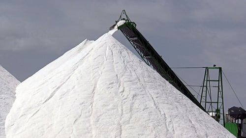 White Salt Piles with Industrial Conveyor Belt