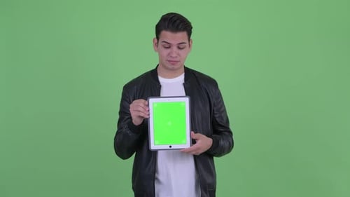 Young Adult Holding Tablet with Green Screen
