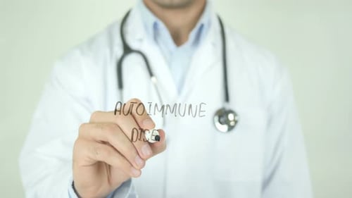 Doctor Writes Autoimmune Disease on Clear Surface