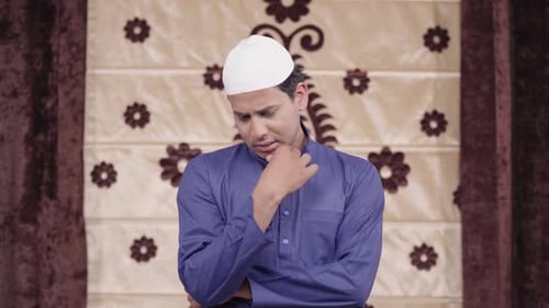 Man in Traditional Dress Has an Idea