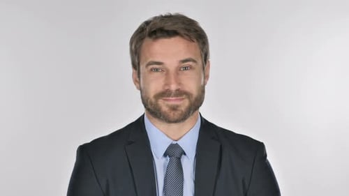 Man in Suit Opens Eyes and Smiles