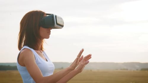 Woman in VR Headset Interacting in Field