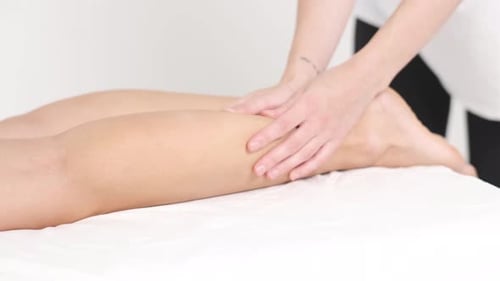 Young Woman Having Massage in Beauty Spa Salon Close Up