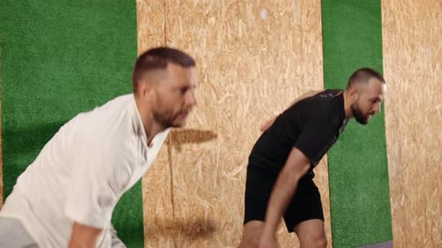 Pretty Active Fitness Men in Sport Clothes Doing Exercises for Jump During Training in Gym