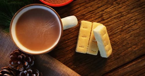 Coffee Mug and Cookies on Wooden Surface