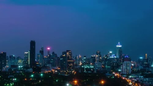 Time Lapse Night Cityscape and Highrise Buildings in Metropolis City Center