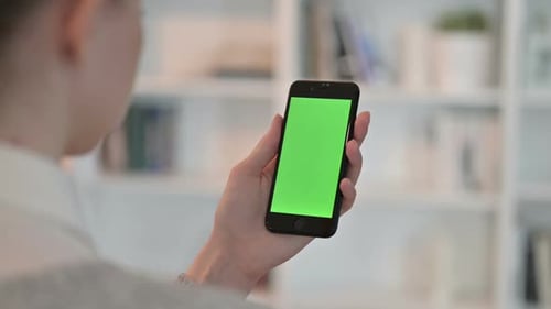 Rear View of Woman Using Smartphone with Chroma Key Screen