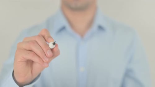 Man Writes the Word Balance on Transparent Surface