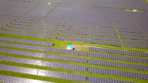 Aerial view of solar power plant field. Electrical photovoltaic panels for producing clean ecologic