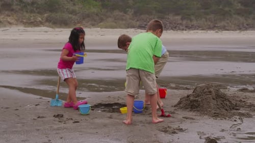 Children playing at beach. Shot on RED EPIC for high quality 4K, UHD, Ultra HD resolution.