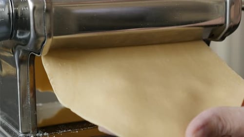 Italian lasagna process with kitchen helper 4K 2160p 30fps UltraHD footage - Close-up of manual past