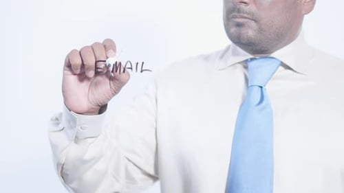 Man Writing Email on Clear Surface