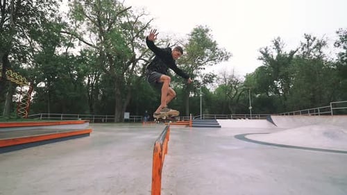 Skateboarder in Skate Park Doing Tricks Slow Motion
