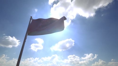 European Union Flag Waving in Sunlight Against Blue Sky