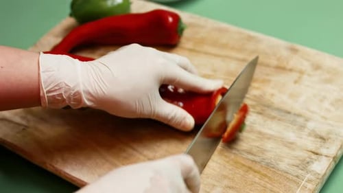 Slicing Red Pepper on Cutting Board Close Up