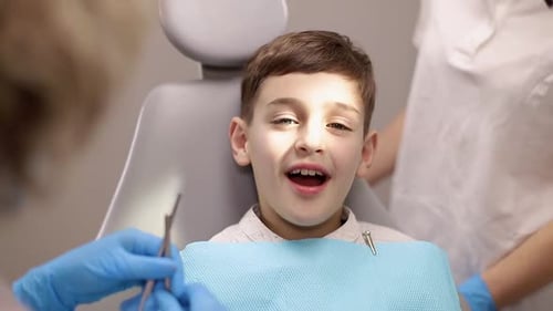 Child Patient Receiving Dental Exam at the Dentist