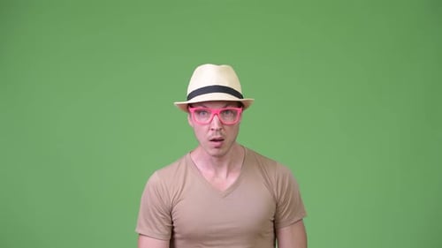 Young Handsome Tourist Man Looking Shocked