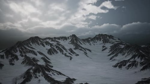 Scenic Drone Flight Over Snowy Mountain Peaks