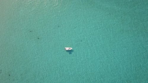 Aerial drone view of a fishing motor boat in the Bahamas, Caribbean.