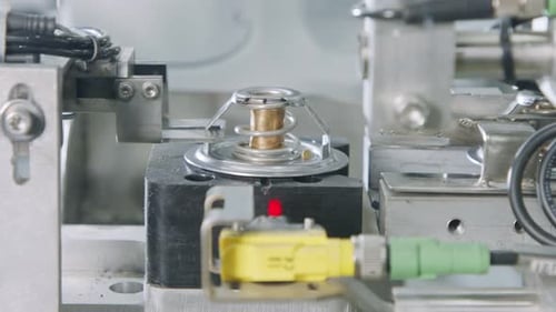 Advanced robotic machine manufacturing parts in an automated assembly line