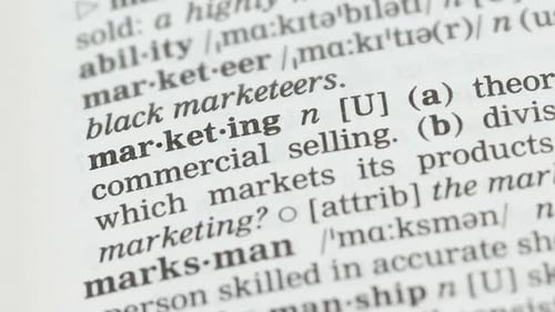 Dictionary Definition of Marketing Being Underlined