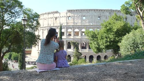 Mother and Daughter Visit Colosseum in Rome