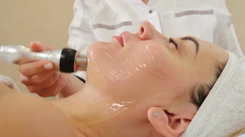 Woman Receiving Facial Skin Treatment Close Up