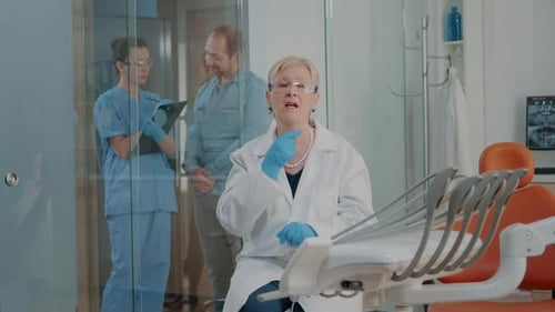 Female Dentist Speaking in Dental Office Setting
