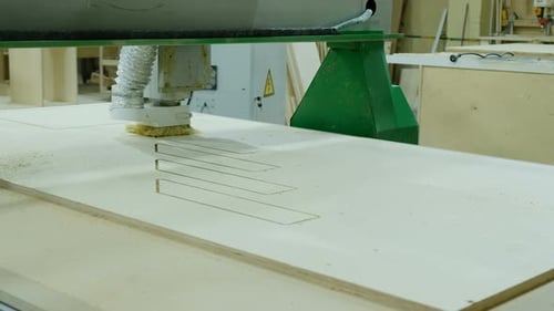 Machine Cutting Wood in Factory