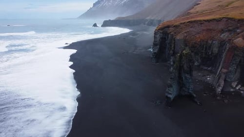 Volcanic Landscape in Iceland Sea Waves on Black Sand Beach Bird's Eye Aerial View of Ocean Waves