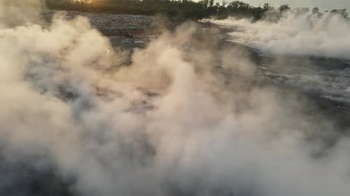 Aerial view fire burning at garbage dump site