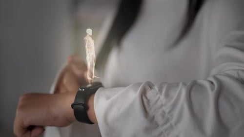 Woman Using Smartwatch for Hologram Body Scan