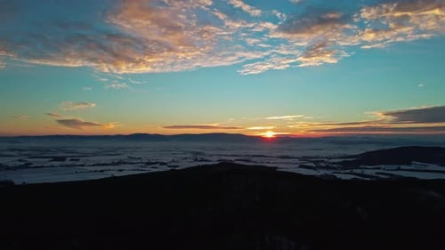 Sunset Over Mountains Covered with Forest