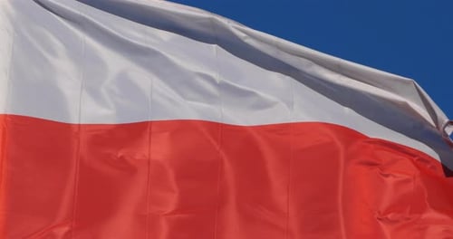 White and Red Flag Waving in Wind