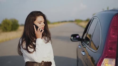 Irritated Alone Woman Talking on Phone at Broken Car Out of City