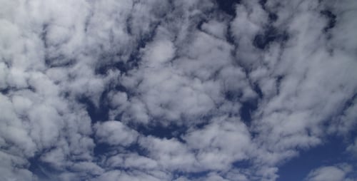 Clouds Moving in a Deep Blue Sky