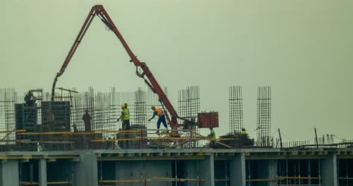 Construction Workers Building New Structure in City