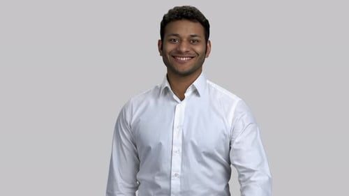 Smiling Young Man Giving a Thumbs Up