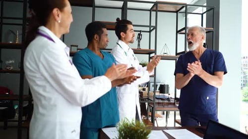Close-up Face of Mature Chief Doctor Which Accepting Congratulations From Successful Medical Team.