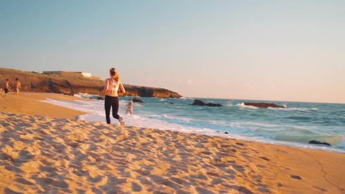 Sporty Blonde Woman Running Ocean Beach