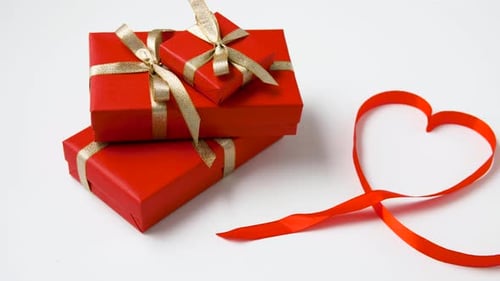 Red Gifts and Ribbon Heart on White Background