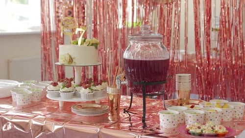 Decorated Birthday Table with Cake, Cupcakes and Drink
